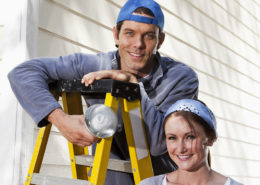 Young couple working on a house.