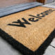 Welcome mat by front door.